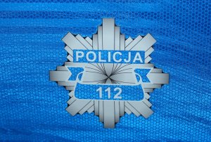 gwiazda policyjna z napisem policja i numerem 112