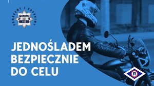 Na niebieskim tle znajduje się tekst Jednośladem bezpiecznie do celu.